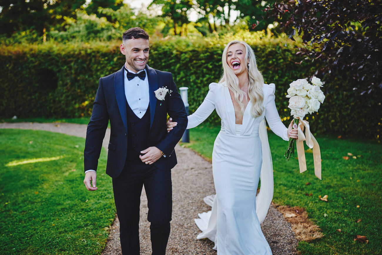 Capturing Love: The Art of Wedding Photography in Ireland 11 Bride and groom holding hands with rings in focus